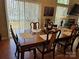 Elegant dining room with ample seating and natural light, perfect for entertaining at 8411 Rhian Brook Ln, Charlotte, NC 28216