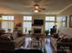 Bright living room with fireplace, hardwood floors, and lots of natural light at 8411 Rhian Brook Ln, Charlotte, NC 28216