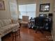 Comfortable home office with natural light, a computer setup, and seating area at 8411 Rhian Brook Ln, Charlotte, NC 28216