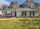 Charming single-story home featuring a well-maintained lawn and classic architectural details at 10707 Copper Field Dr, Pineville, NC 28134