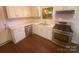 Well-equipped kitchen features stainless steel appliances, white cabinets, and modern countertops at 10707 Copper Field Dr, Pineville, NC 28134