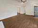 Spacious living room with a vaulted ceiling and hardwood floors, filled with natural light at 10707 Copper Field Dr, Pineville, NC 28134