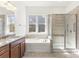 Bathroom with tub, glass shower, and granite countertop vanity at 11037 Thornbeck Ln, Midland, NC 28107