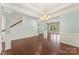 Formal dining area featuring wainscoting, decorative lighting, and hardwood floors at 11037 Thornbeck Ln, Midland, NC 28107