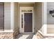 Front entrance with stone accents and stylish brown door at 11037 Thornbeck Ln, Midland, NC 28107