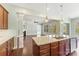 Modern kitchen with granite countertops, stainless steel appliances, and views of the living room and backyard at 11037 Thornbeck Ln, Midland, NC 28107