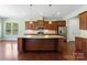Spacious kitchen features granite countertops, stainless steel appliances, and a large center island at 11037 Thornbeck Ln, Midland, NC 28107
