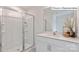 Modern bathroom featuring a glass enclosed shower, large mirror and vanity at 2048 Harlequin Dr, Indian Trail, NC 28079