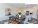 Light-filled dining room with modern table and chairs, adjacent to the kitchen at 2048 Harlequin Dr, Indian Trail, NC 28079