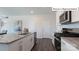 Bright kitchen with granite countertops, stainless steel appliances and gray plank flooring at 2048 Harlequin Dr, Indian Trail, NC 28079