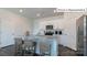 Modern kitchen with white cabinets, granite countertops, and stainless steel appliances at 2048 Harlequin Dr, Indian Trail, NC 28079