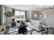Bright living room with a comfortable white sectional, stylish decor, and a large window at 2048 Harlequin Dr, Indian Trail, NC 28079