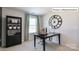 Home office with black desk, bookcase and chair at 2048 Harlequin Dr, Indian Trail, NC 28079