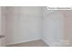 Large walk-in closet with metal organizers and neutral carpet at 2048 Harlequin Dr, Indian Trail, NC 28079