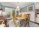 Charming dining room with hardwood floors, chandelier lighting, and access to the backyard at 3004 Vernell Ln, Shelby, NC 28150