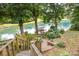 Beautiful view of a waterfront dock with boats and seating, accessible by stairs at 3004 Vernell Ln, Shelby, NC 28150