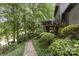 Landscaped path leading to a house with a deck, showcasing lush greenery and brick accents at 3004 Vernell Ln, Shelby, NC 28150