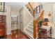 Hallway with wood staircase and a glimpse of the kitchen at 3004 Vernell Ln, Shelby, NC 28150