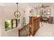 A home hallway features decorative accents, staircase with wood railing, and chandelier lighting at 3004 Vernell Ln, Shelby, NC 28150
