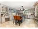 Spacious kitchen with gray cabinets, tile backsplash, and a center island with seating at 3004 Vernell Ln, Shelby, NC 28150