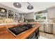 Kitchen featuring a central island cooktop, custom cabinets, and stainless steel appliances at 3004 Vernell Ln, Shelby, NC 28150