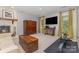 An open-concept living room showcases a fireplace and leads to windows with natural light at 3004 Vernell Ln, Shelby, NC 28150