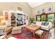 Comfortable living room with vaulted ceilings, built-in bookshelves, and natural light at 3004 Vernell Ln, Shelby, NC 28150