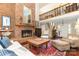 Cozy living room with brick fireplace, hardwood floors, and a second-story balcony at 3004 Vernell Ln, Shelby, NC 28150