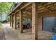 Covered patio with brick columns, outdoor dining set, and recessed lighting for relaxing evenings at 3004 Vernell Ln, Shelby, NC 28150