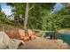 Waterfront area with seating, brick accents, and mature trees offering a serene outdoor experience at 3004 Vernell Ln, Shelby, NC 28150