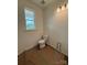New bathroom featuring a toilet and a window; construction in progress at 309 Knotty Wood Dr # 78, Monroe, NC 28110