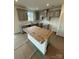 New kitchen featuring gray cabinets, stainless steel sink and fixtures and an island at 309 Knotty Wood Dr # 78, Monroe, NC 28110