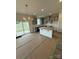 New kitchen featuring gray cabinets, stainless steel sink and fixtures and island at 309 Knotty Wood Dr # 78, Monroe, NC 28110