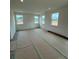 Spacious living room featuring large windows, ample natural light and new floors at 309 Knotty Wood Dr # 78, Monroe, NC 28110