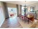 Elegant dining room featuring a wooden table, stylish chairs, and access to an outdoor patio at 313 Knotty Wood Dr # 79, Monroe, NC 28110