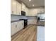 Beautiful kitchen featuring stainless appliances, modern cabinets, and light wood floors providing an ideal cooking space at 313 Knotty Wood Dr # 79, Monroe, NC 28110