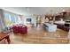Open-concept living space featuring hardwood floors, recessed lighting, and modern furnishings at 313 Knotty Wood Dr # 79, Monroe, NC 28110