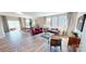Open-concept living space featuring hardwood floors, large windows, and modern decor at 313 Knotty Wood Dr # 79, Monroe, NC 28110