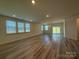 Spacious living room features lots of natural light and hardwood floors at 313 Knotty Wood Dr # 79, Monroe, NC 28110