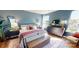 Cozy main bedroom with ample natural light, stylish furniture, and hardwood floors at 313 Knotty Wood Dr # 79, Monroe, NC 28110