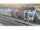 Aerial view of modern townhomes featuring street views with sidewalks and landscaping at 3626 S Tryon St # 21, Charlotte, NC 28217