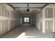 Unfinished two car garage with visible drywall and an automatic door at 3626 S Tryon St # 21, Charlotte, NC 28217