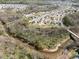 Aerial view of neighborhood near a creek with green space at 8137 Bryson Rd, Fort Mill, SC 29707