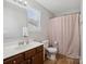A bathroom featuring a wooden cabinet sink and a matching wooden floor at 8137 Bryson Rd, Fort Mill, SC 29707