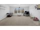 Bright bedroom featuring a large window and ample space for flexible furniture arrangements at 8137 Bryson Rd, Fort Mill, SC 29707