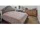 Comfortable bedroom with a tufted headboard, offering a relaxing and stylish retreat at 8137 Bryson Rd, Fort Mill, SC 29707