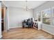 Simple dining room with hardwood flooring, a chandelier, natural light, and space for a desk at 8137 Bryson Rd, Fort Mill, SC 29707