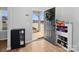 Bright entryway with hardwood flooring, a decorative wreath on the door and storage shelves at 8137 Bryson Rd, Fort Mill, SC 29707