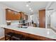 Spacious kitchen features stainless steel appliances, wood cabinets, quartz countertops, and bar seating at 8137 Bryson Rd, Fort Mill, SC 29707