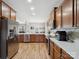 Bright and spacious kitchen with stainless steel appliances, wood cabinets, and an open layout at 8137 Bryson Rd, Fort Mill, SC 29707